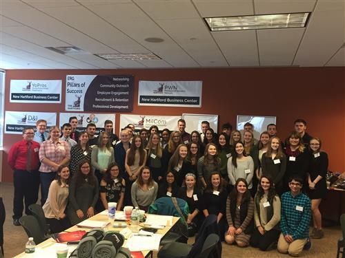 a large group of students with nametags smiling
