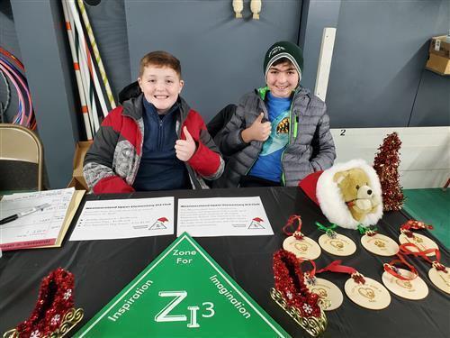 Two students at booth